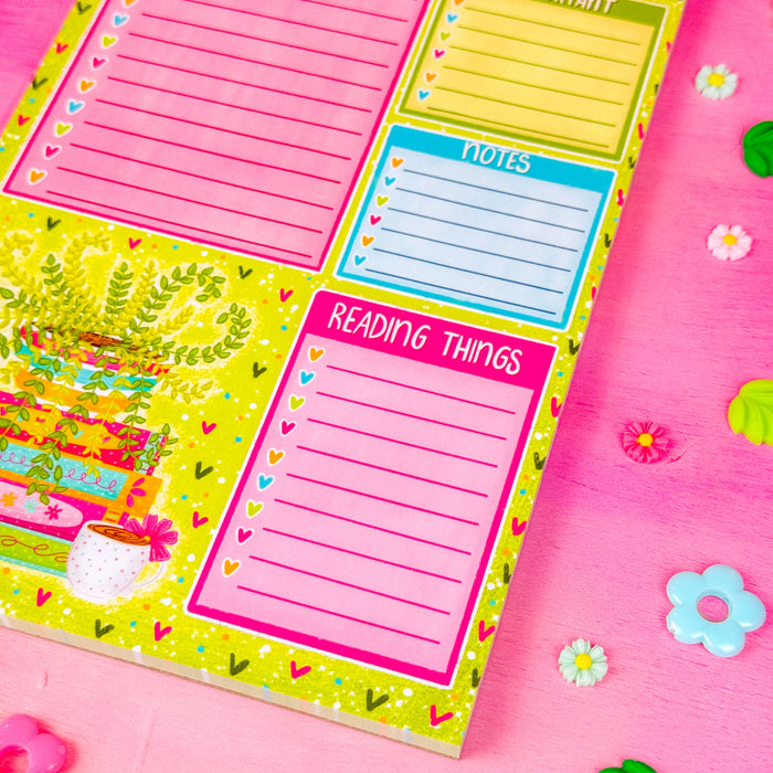 A notepad with sections for a to do list, important items, notes, and reading things. Featuring a green plant in the lower left corner and spring themed books and hearts around the border.