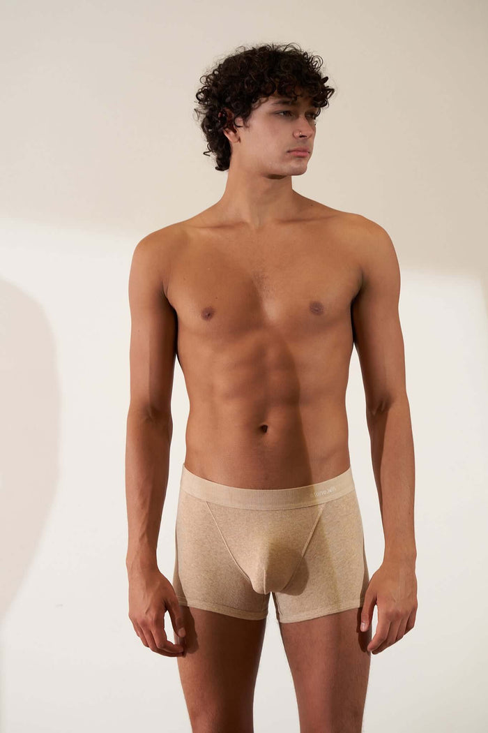 Boxer brief in organic cotton rib, sand melange with orange cross, showcasing comfort, GOTS certified, non-toxic fabric.