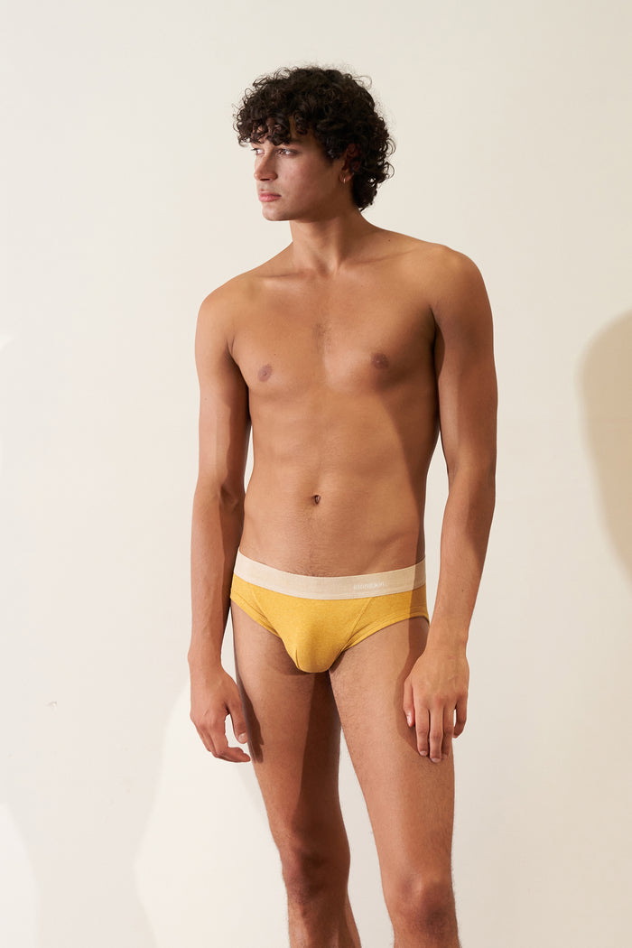Men's Brief in Organic Cotton Rib - Mustard / Sand model showcasing comfortable fit and design.