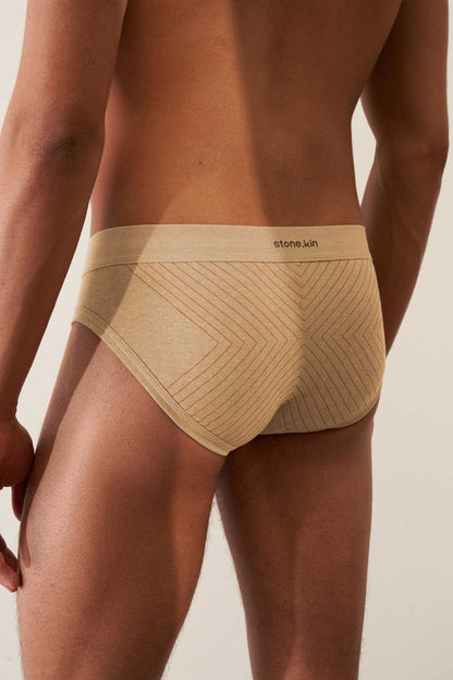 Organic cotton rib brief in sand with orange cross, featuring comfort waistband and GOTS certification.