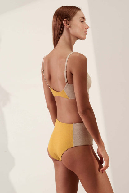 Contoured High Waisted Brief in Organic Cotton Rib / Sand & Mustard model wearing high-waisted underwear from the back.