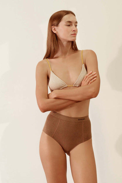 Model wearing Hi Brief in Organic Cotton Rib - Brown, showing high-waisted design and softness in organic cotton fabric.