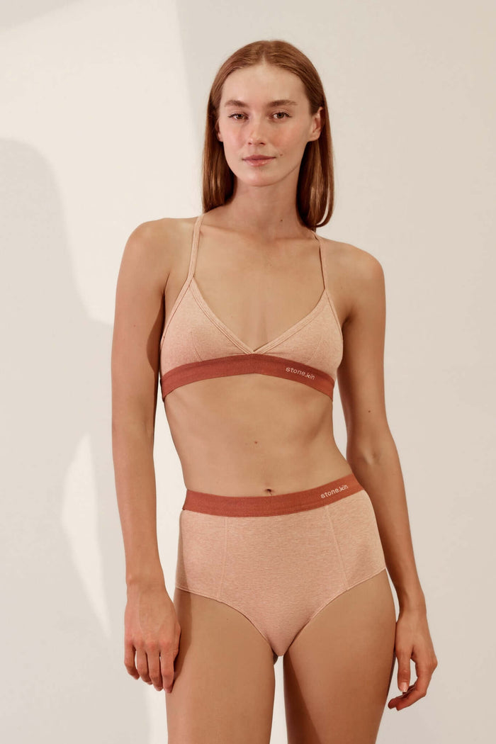 Hi Brief in Organic Cotton Rib - Nude and Rust worn by a model, showcasing the high-waisted design and comfortable fit.