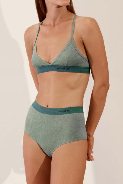 Hi Brief in Organic Cotton Rib - Sage and Teal worn by a model showing a high-waisted design and soft rib fabric.