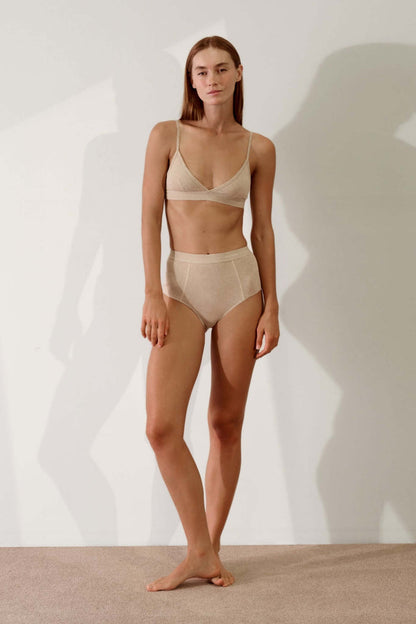 Model wearing Hi Brief in Organic Cotton Rib - Sand and matching top, showcasing softness and comfort.