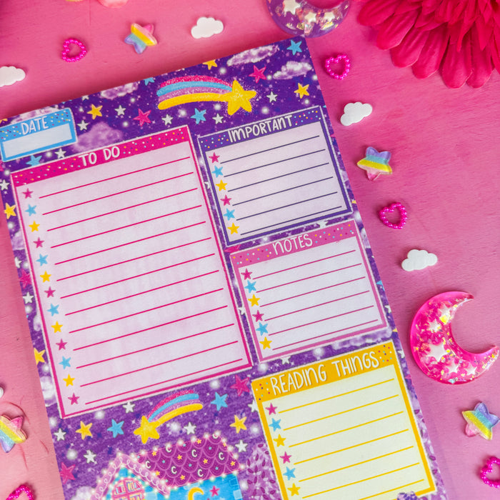 Late night bookshop daily planner notepad on pink backdrop