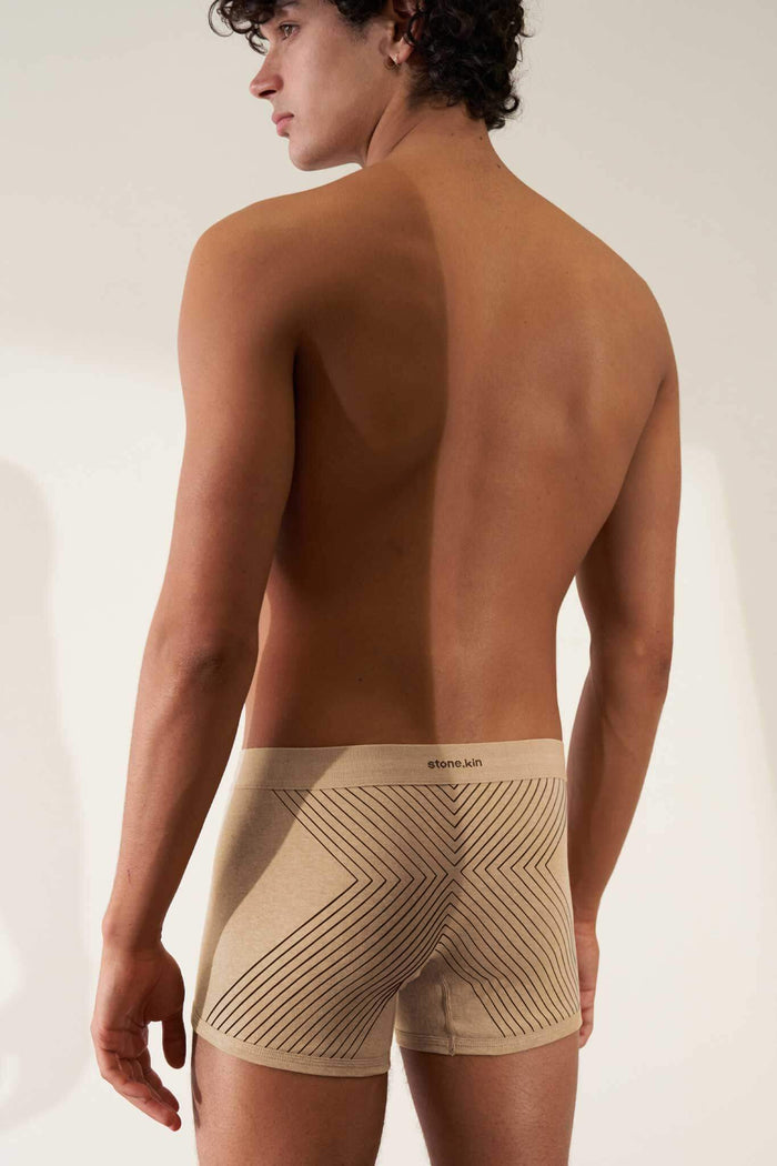 Men's organic cotton boxer brief in sand melange rib with tar cross design, offering comfort and GOTS certified non-toxic fabric.