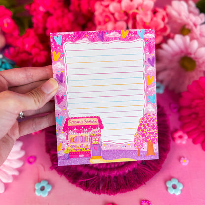 Romance bookshop notepad on a pink backdrop
