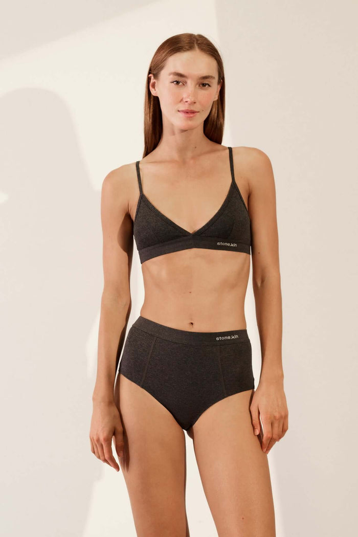 Scoop Back Bralette in Organic Cotton Rib - Tar worn by a model, showcasing its soft and supportive design.