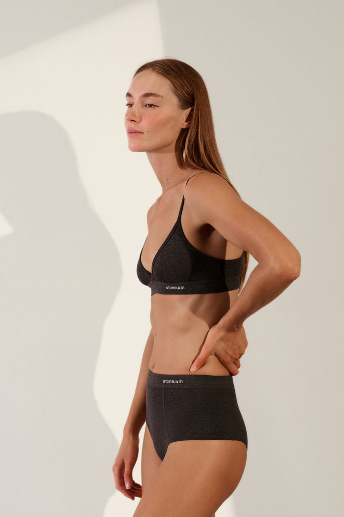Scoop Back Bralette in Organic Cotton Rib worn by model, showcasing the slimline scoop-back design in soft tar color.