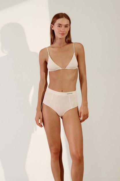 Model wearing Triangle Bralette in Organic Cotton Rib - Bone with matching high-waisted underwear.