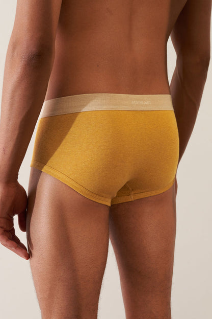 Trunk in Organic Cotton Rib - Mustard / Sand, showing a modern European cut and soft ribbed texture.