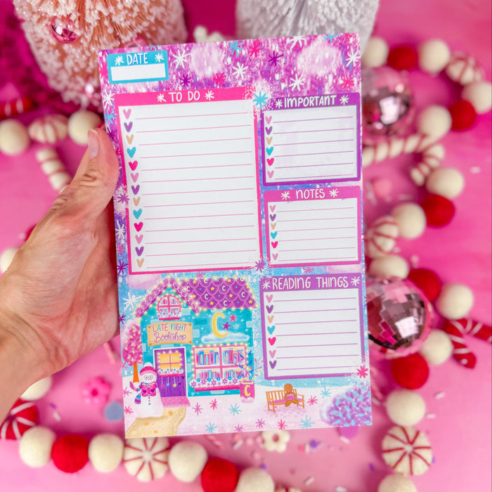 A notepad with sections for a to do list, important items, notes, and reading things. Featuring a late night bookshop in the lower left corner.