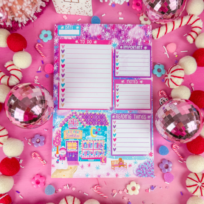 A notepad with sections for a to do list, important items, notes, and reading things. Featuring a late night bookshop in the lower left corner.