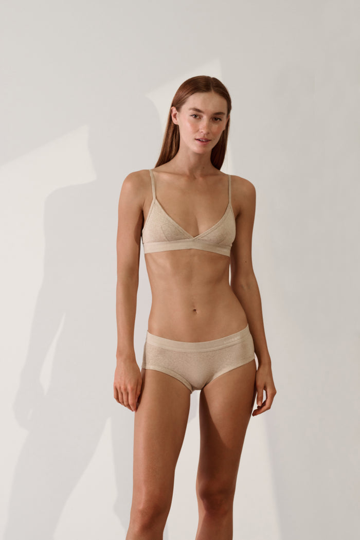 Women's Brief in Organic Cotton Rib - Sand displayed on model, showcasing soft and stylish sustainable underwear.