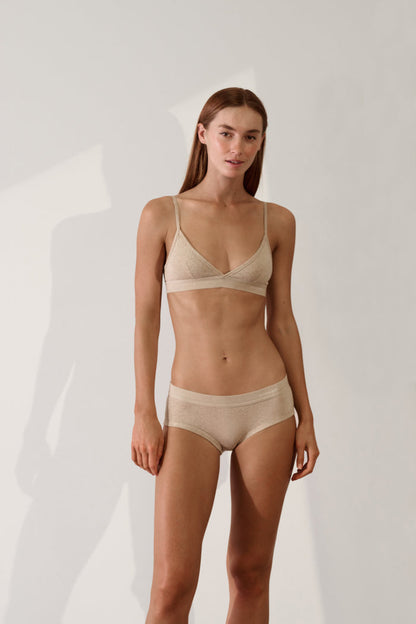 Women's Brief in Organic Cotton Rib - Sand displayed on model, showcasing soft and stylish sustainable underwear.